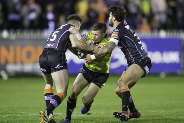 Hull FC's Jamie Shaul is tackled by Castleford's Greg Eden & Alex Foster. Picture by Allan McKenzie/SWpix.com