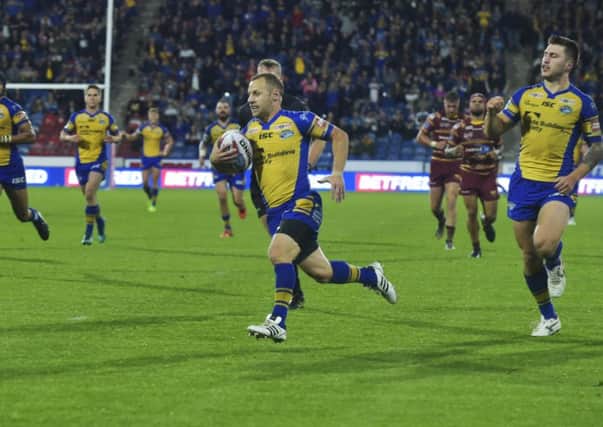 GET IN: Rob Burrow races in for his 168th Super League try at Huddersfield on Friday night.