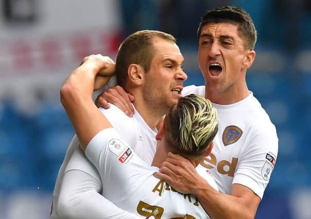 New dad: Leeds United's Pierre-Michel Lasogga is congratulated on scoring his team's opening goal during the Sky Bet Championship match at Elland Road, Leeds.