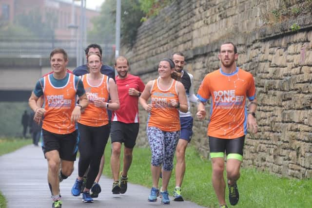 Scott Cranmer, front right with supporters, completes running one million metres in  memory of his late friend Chris Chapman. Picture Scott Merrylees