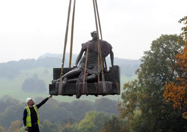 NEW HOME: Sculpture technicians use specialist equipment and cranes to take Old Flo off display. PIC: Scott Merrylees