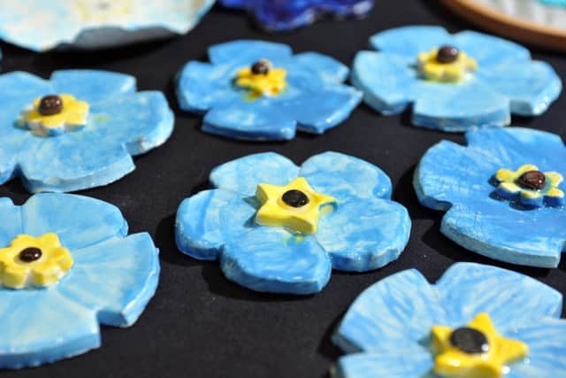 26 September 2017......    Natalie Haigh from the Leeds City Museum where forget-me-nots have been made by organisations and people in Leeds to raise awareness of dementia. Picture Tony Johnson.