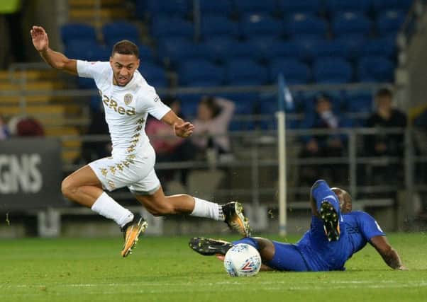 Kemar Roofe avoids a challenge from former Leeds defender Sol Bamba.