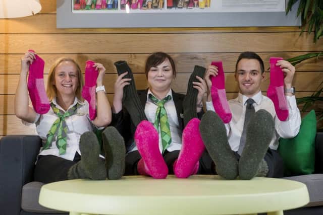Getting ready for the Yorkshire Building Society Socktober campaign are, from the left, Claire Byrne, Natalie Butterworth and Adam Waterfall. Picture: Mark Bickerdike