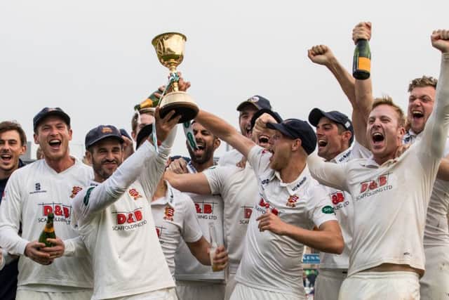 Essex's players celebrate with the Division 1 County Championship trophy after thrashing Yorkshire by 376 runs. Picture: Steven Paston/PA.