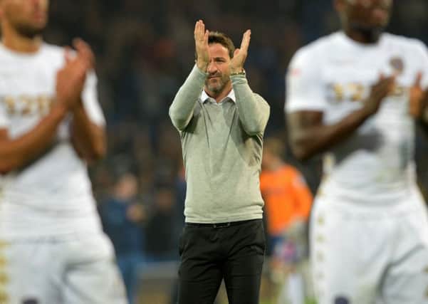 Leeds United boss Thomas Christiansen applauds the travelling fans at Cardiff on Tuesday night.  Picture: Bruce Rollinson