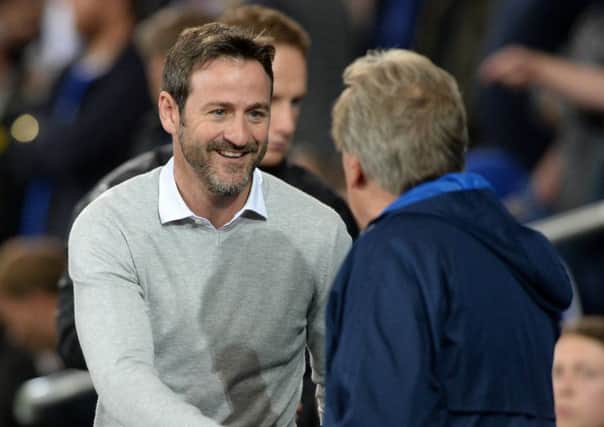Thomas Christiansen and Neil Warnock shake hands before the Championship clash in Cardiff on Tuesday night.  Picture: Bruce Rollinson