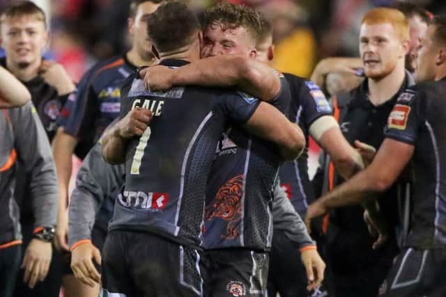 Luke Gale and Adam Milner celebrate the victory over St Helens.