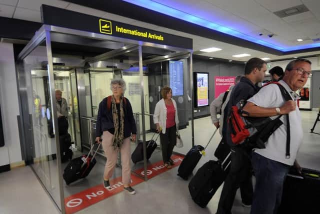 Monarch passengers arrive at Leeds Bradford Airport after a repatriation flight from Dalaman Mugla. Pictures: Simon Hulme