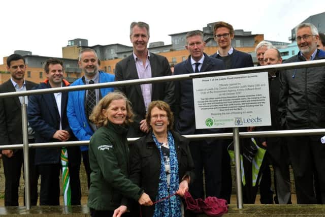 041017    Emma  Howard Boyd Chairman of the Environment Agency  (left) and Cllr Judith Blake Leader of Leeds City Council who jointly  opened  of the first phase of the Leeds Flood Alleviation scheme near to the Royal Armouries,  yesterday(wed) unveiling a plaque at the site.