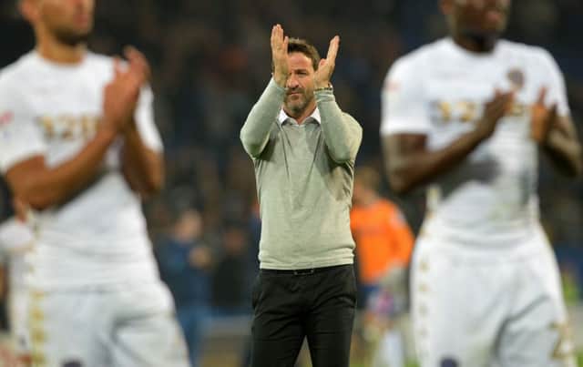 Thomas Christiansen appluds the travelling fans at Cardiff  Picture: Bruce Rollinson
