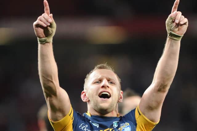 Raising the roof: Rob Burrow pointing skywards after another Grand Final win in 2012.