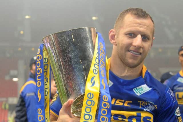 Rob Burrow with the Grand Final trophy after the 2011 win (Picture: Steve Riding)