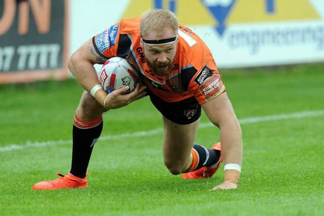 Try time: Oli Holmes crosses the tryline for Castleford Tigers against Wakefield Trinity. (Picture: Scott Merrylees)