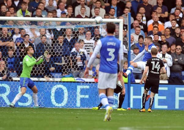 Sheffield 
Wednesday's Gary Hooper scores his second goal in the win over Leeds.