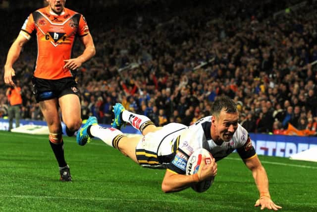 Man of the match Danny McGuire crosses for the first of two tries