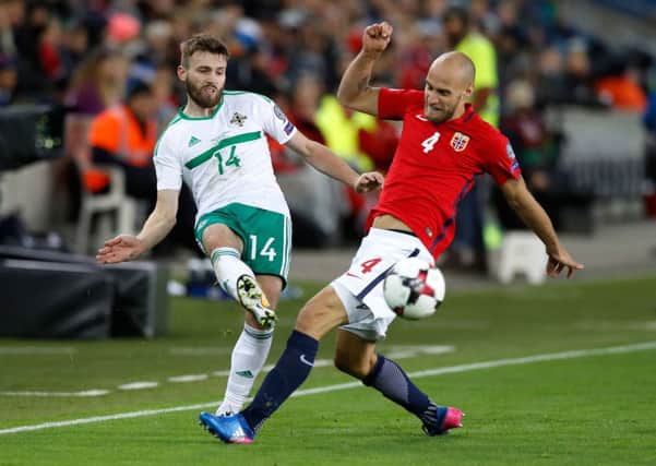 Leeds United and Northern Ireland's Stuart Dallas (left) and Norway's Tore Reginiussen in action during the 2018 FIFA World Cup Qualifying Group C match at the Ullevaal Stadion, Oslo. (Picture: Martin Rickett/PA Wire)