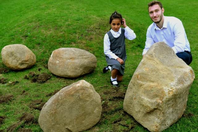Imaan Iqbal 8 with geologist Callum Abbiss at Alwoodley Primary School in Leeds.