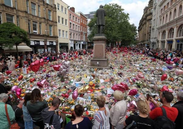 Flowers and tributes left in St Ann's Square in Manchester following the Manchester Arena terror attack. Credit: Danny Lawson/PA Wire