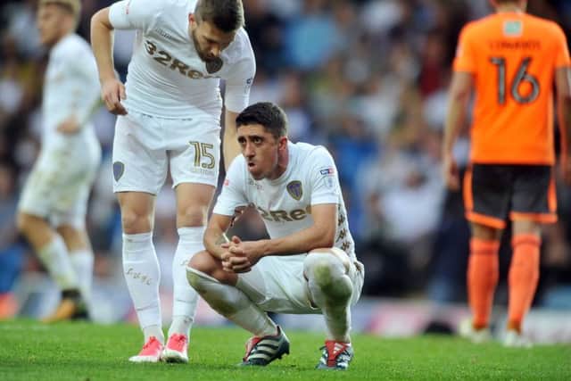 Stuart Dallas consoles Pablo Hernandez after his late penalty miss against Reading.
