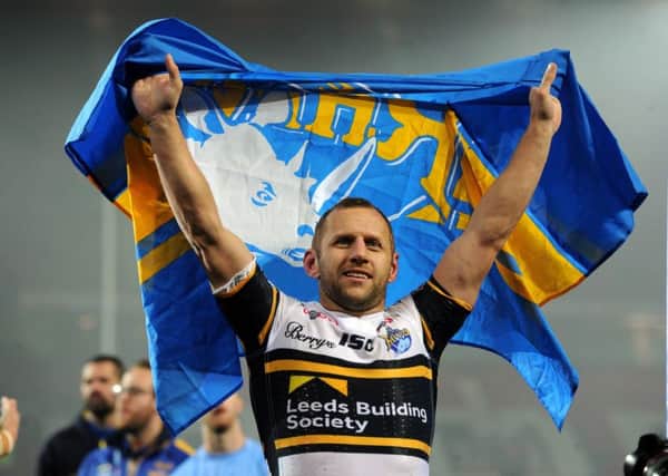 Rob Burrow salutes the Rhinos fans after this year's Grand Final triumph. PIC: Bruce Rollinson