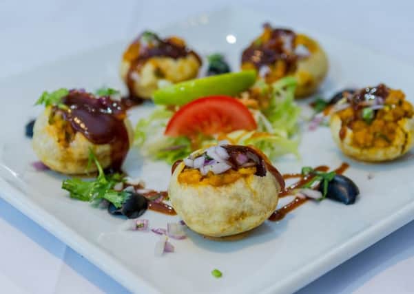 Date: 11th October 2017.
Picture James Hardisty.
Oliver Review...........Blue Tiger, Ganners Hill, Bramley, Leeds. Pictured Gol Gappay, Crispy circular pastry stuffed with tangy spicy chickpeas, caramelised onions, tomato, garlic, puree, mashed bombay potato and drizzle of lime and tamarind sauce, down the hatch in one go.