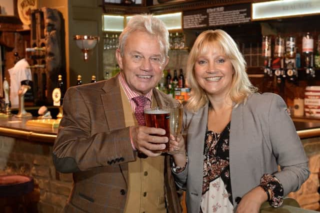 MEMORIES: Malandra Burrows (Kathy Glover) and Frazer Hines (Joe Sugden) celebrate Emmerdale's 45th anniversary.  PIC: Bruce Rollinson