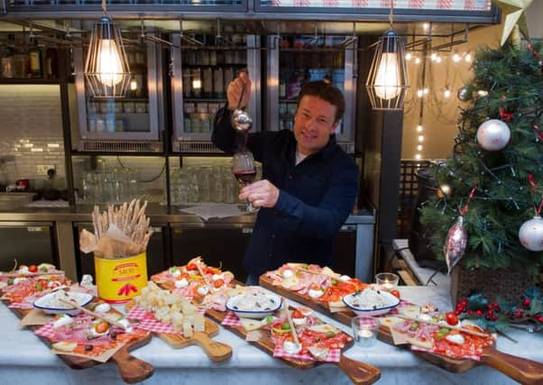 Date: 31st October 2017.
Picture James Hardisty.
Celebrity chef Jamie Oliver, visting his Leeds restaurant Jamie's Italian, Park Row, Leeds, where he met a group of prize winners, to talk to them about his new Christmas menu, and general cooking ideas.