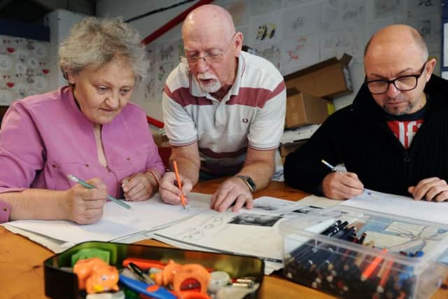 Volunteer Derek Sykes teaches Gillian Cooper at the art and conversation class.
Picture Jonathan Gawthorpe