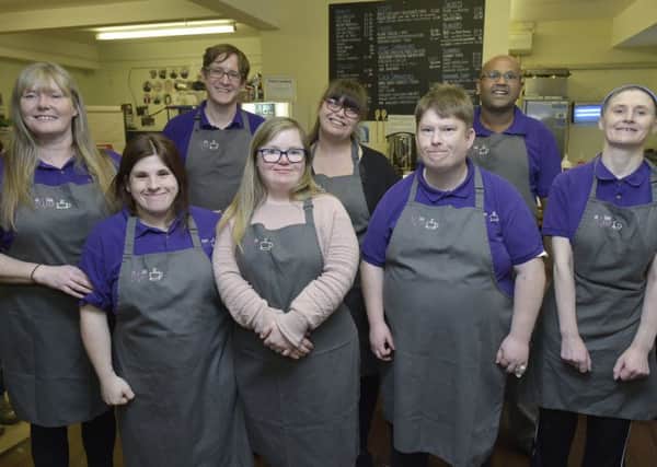 Angie Marshall, cafe manager and Derek Nixon assistant manager at Cafe Leep with trainees celebrate winning the regional round of Britain's Best Cafe.