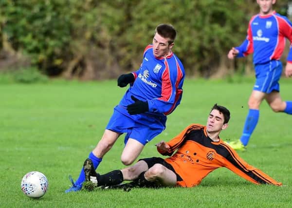 Old Bank's Jonny Mitchell and Josh Auty, of Battyeford, in Heavy Woollen League action. PIC: Paul Butterfield