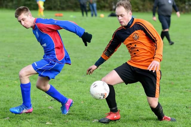 Matty Evans, of Old Bank, and visiting Battyeford's Josh Auty. PIC: Paul Butterfield