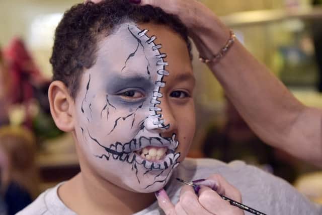 Benjamin Walker, 12, of Chapeltown, has his face painted at the St John's shopping centre event. Pictures: Steve Riding