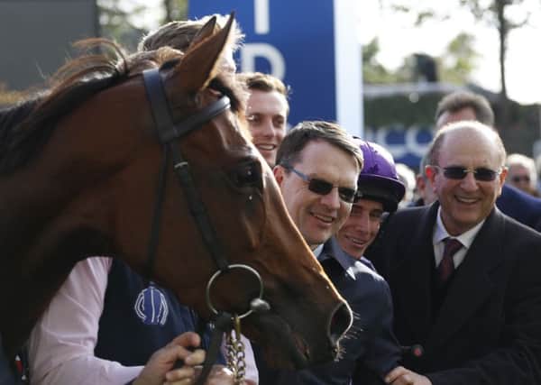 Trainer Aidan O' Brien (centre) has launched a four-horse assault on the Racing Post Trophy. PIC: Julian Herbert/PA Wire