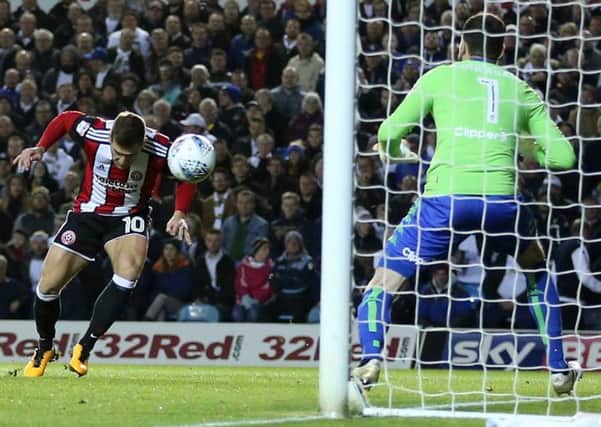 EARLY STRIKE: Sheffield United's Billy Sharp scores his side's first goal of the game.