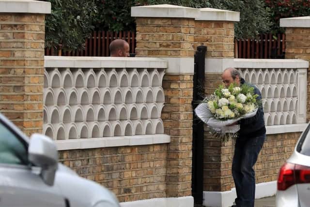Flowers are delivered to the home of X Factor judge Simon Cowell a day after he was reportedly taken to hospital after falling down the stairs at the house. PIC: PA