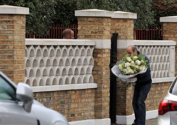 Flowers are delivered to the home of X Factor judge Simon Cowell a day after he was reportedly taken to hospital after falling down the stairs at the house. PIC: PA