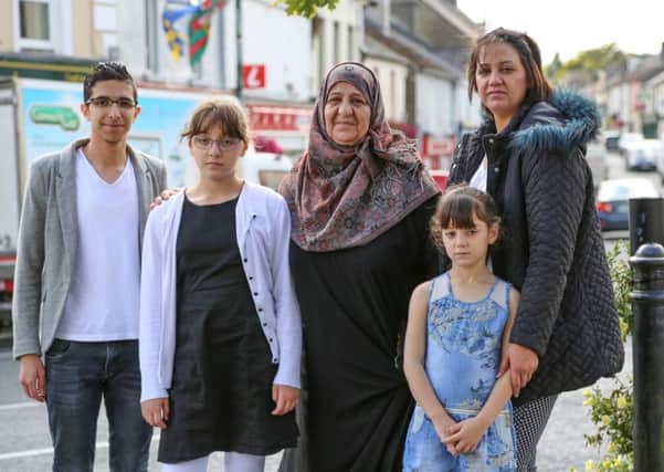 EAST MEETS WEST: From left to right, Ghassan, Ahlam, Seeham, Jenan and Judy on the streets of Ballaghaderreen in western Ireland in Hotel for Refugees.