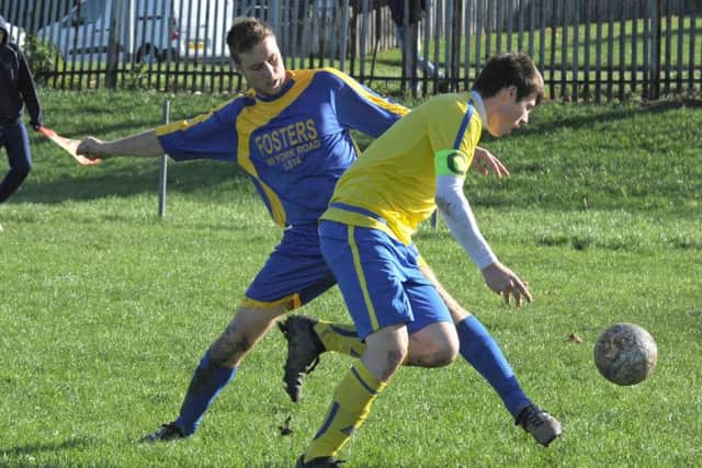 Mark Flanagan wins the ball for New Armley Blues at South Seacroft. PIC: Steve Riding