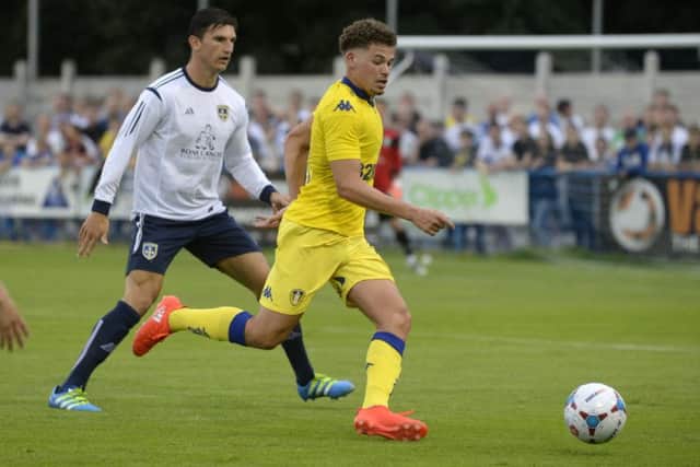 Guiseley's Ash Palmer, left.