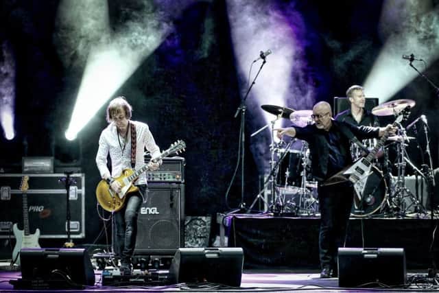 ON STAGE: Mark Abrahams, left, with Wishbone Ash veteran Andy Powell. Picture: Roland Kaempfer