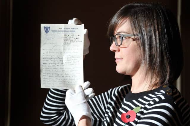 Curator of Leeds City Museum Ruth Martin with the letter from Horace Iles which he sent to his sister in Leeds just days before his death in the Battle of the Somme.