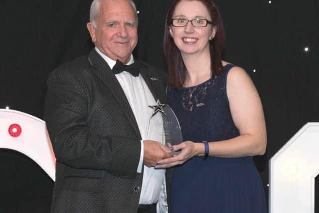 Brian Firth receives his award.