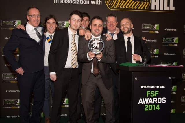 The Square Ball team celebrate their win at the 2014 awards.