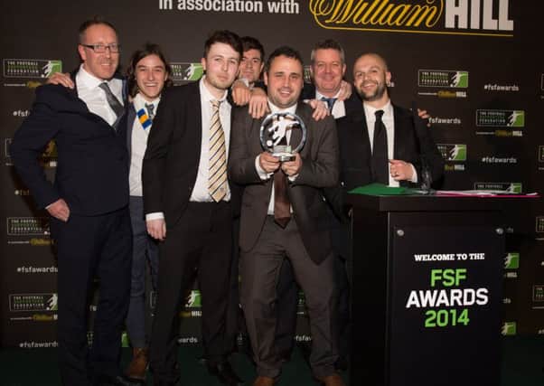 The Square Ball team celebrate their win at the 2014 awards.
