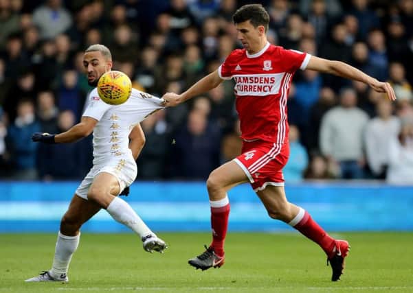 LEADING THE LINE: Middlesbrough's Daniel Ayala, right, attempts to get to grips with Leeds United striker Kemar Roofe. Picture by Jonathan Gawthorpe.