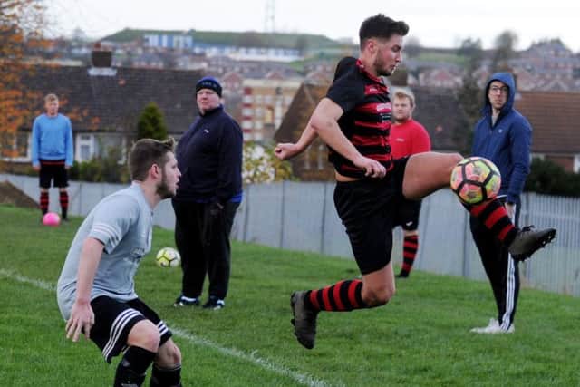 HIGH-FLIER: Stanley United's Luke Hammond of Stanley United keeps the ball in play during his side's 3-0 win over Stanningley OB. Picture: Steve Riding.