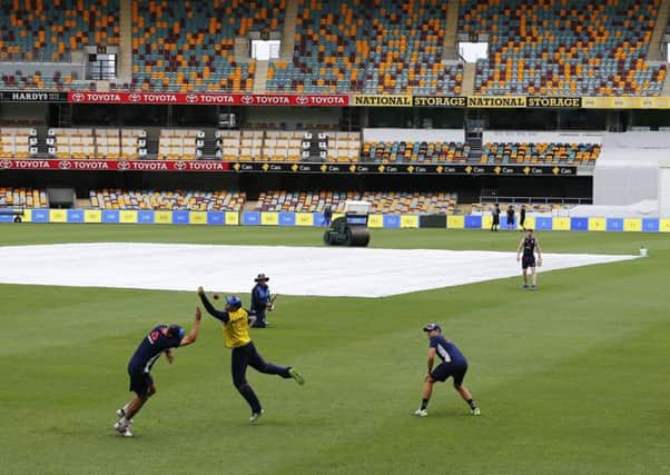 Joe Root attempts to take a catch during a nets session at The Gabba, Brisbane on Tuesday (Picture: Jason O'Brien/PA Wire).