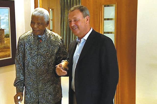 Jeremy Thompson chatting with Nelson Mandela in 2007.