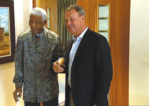 Jeremy Thompson chatting with Nelson Mandela in 2007.